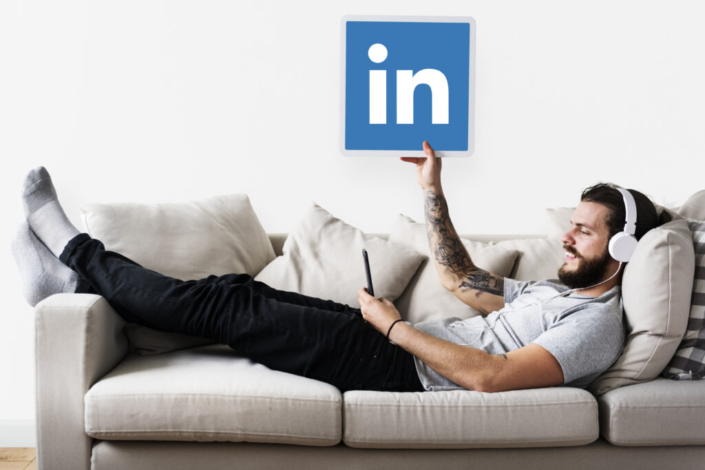 person holding linkedin icon