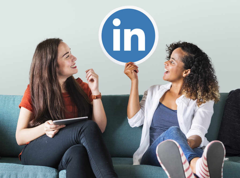 women holding linkedin logo